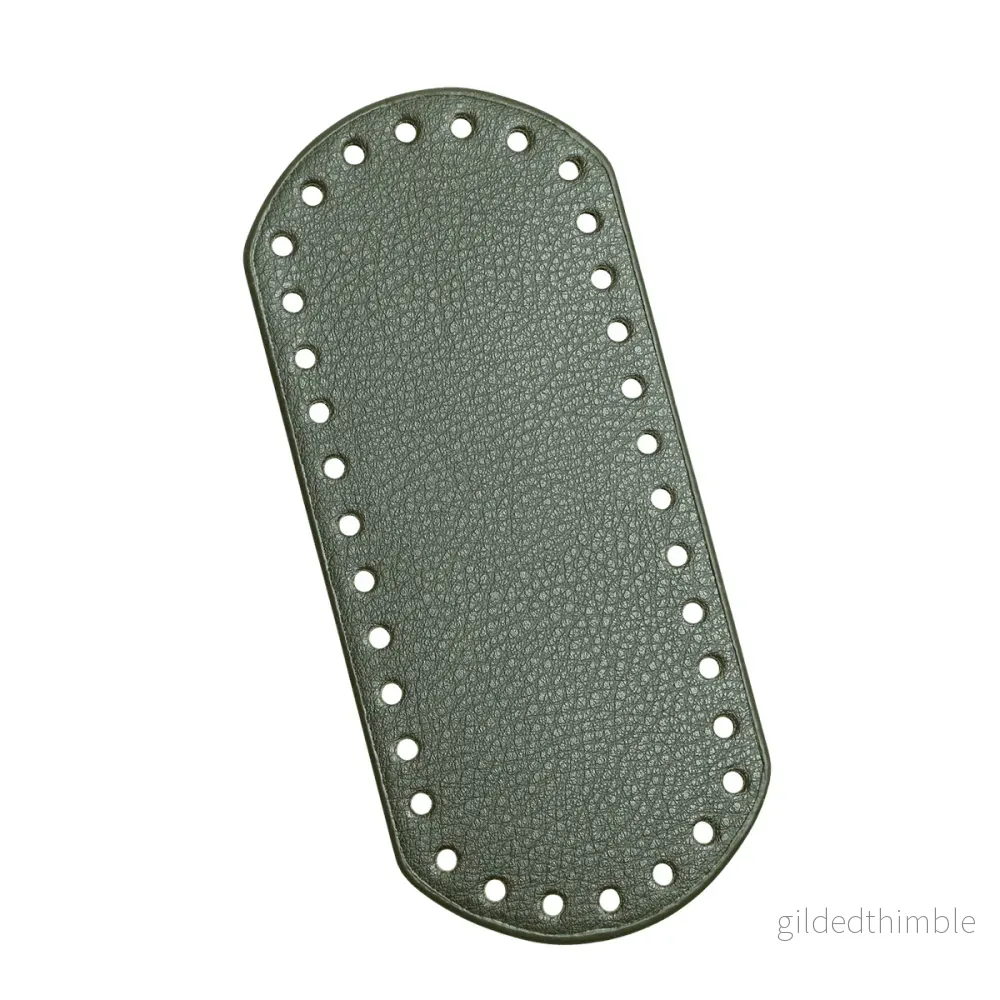 Väskbotten i grön konstläder 18,5×8 cm.