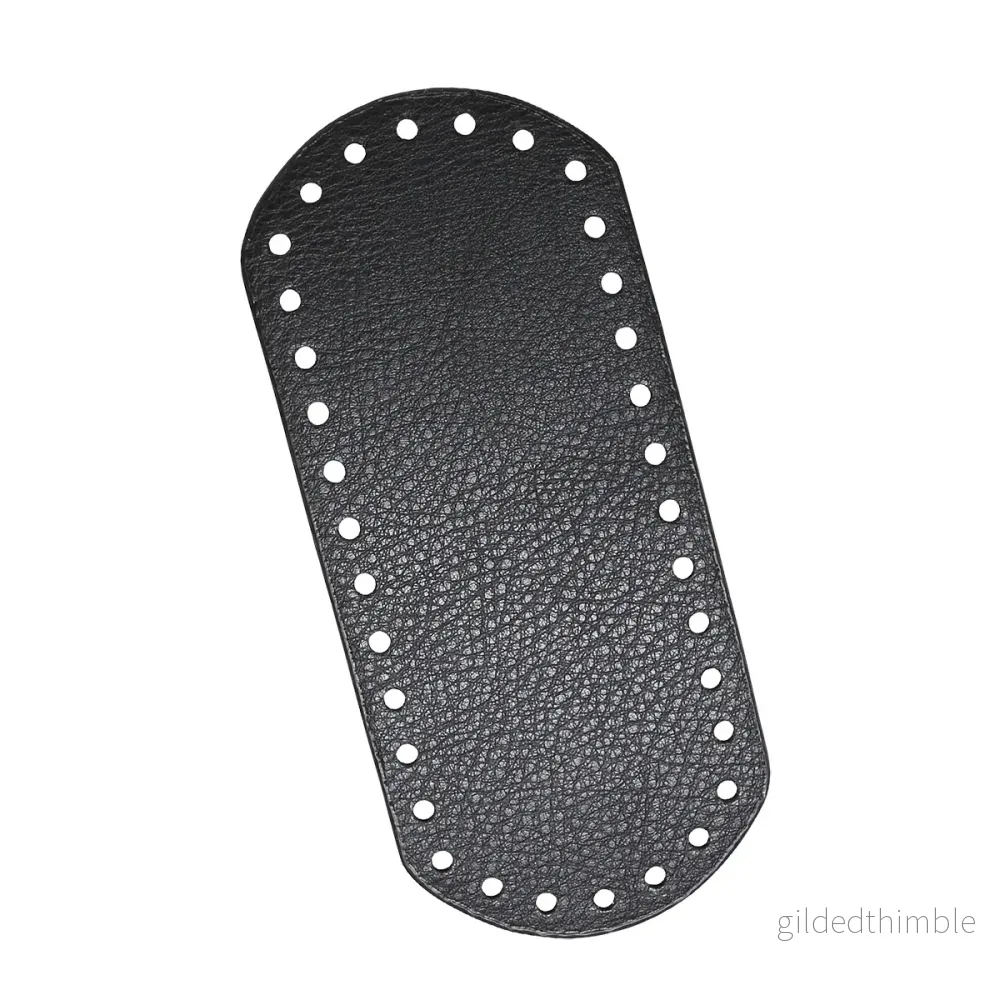 Väskbotten i svart konstläder 18,5×8 cm. Väskbotten i svart konstläder 18,5×8 cm.