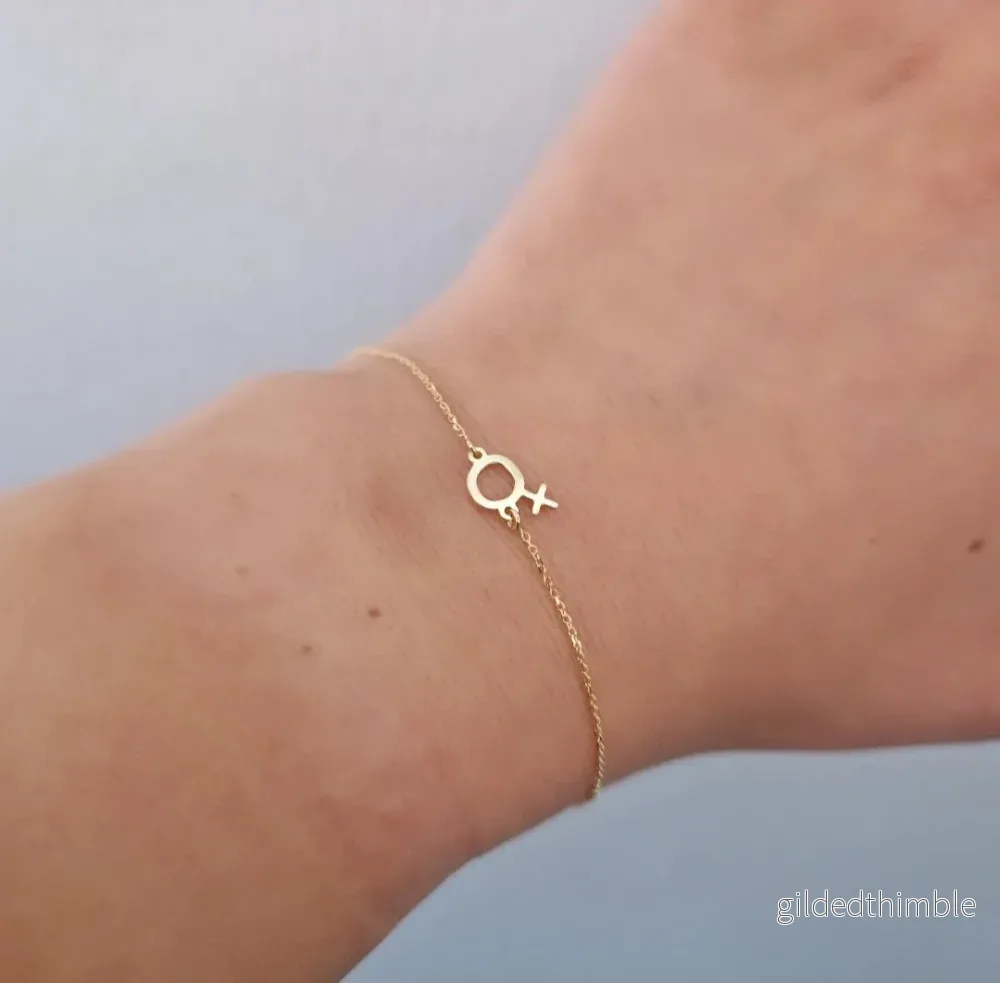 Armband kvinnosymbol guld Armband kvinnosymbol guld