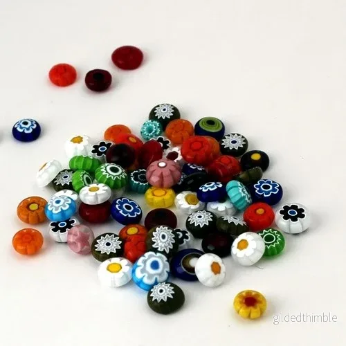 Burnt Millefiori Transparent, 10-12mm, 100g ca. 90 st Burnt Millefiori Transparent, 10-12mm, 100g ca. 90 st