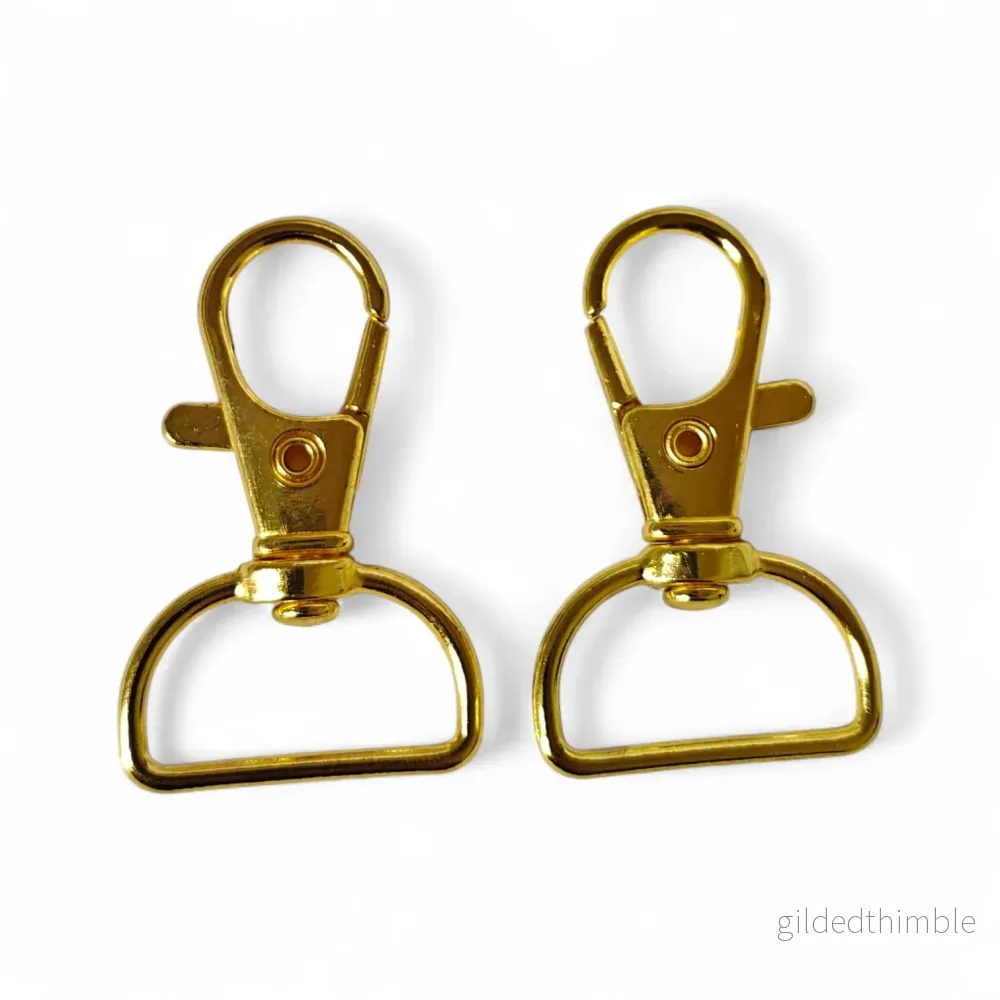 Karbinhake med vridbar ögla 25x40mm Guld Karbinhake med vridbar ögla 25x40mm Guld